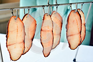 Fish Pastrami Slices Hanging On A Hook