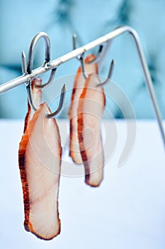 Fish Pastrami Slices Hanging On A Hook