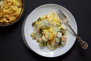 Fish pie with sliced potato topping