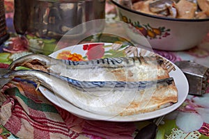 Fish in a plate,cooking Clupea fish at home on a plate
