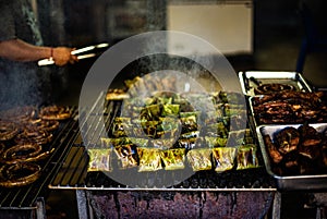 Fish and pork wrapped in banana leaves and grilled over charcoal, known as Ho Mok, is a traditional dish of northern Thailand.