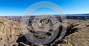 The Fish River Canyon `Visrivier Canyon` or `Visrivier Kuil` during dry season in southern Namibia from southern lookouts