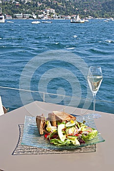 Fish salads with seasonal fish and vegetables with white wine from Istanbul Bosphorus photo