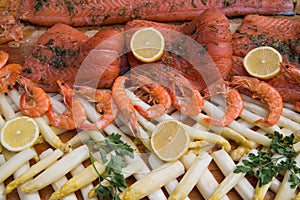 Fish salmon and shrimp on a decorated table