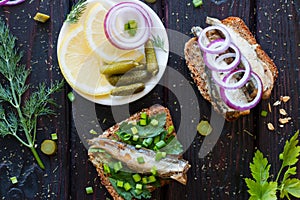 Fish sandwiches and a plate with lemon onions
