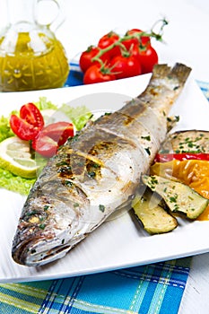 Fish, sea bass grilled with lemon