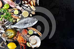 Fish and seafood background with copy space, a flat lay top shot. Sea bream, crab etc