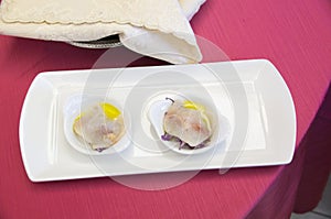 Fish snacks, Mediterranean cuisine on red tablecloth in Italian restaurant.