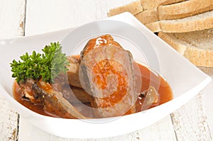 Fish soup in a bowl and bread