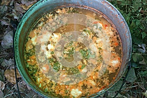 The fish soup in the cauldron is ready