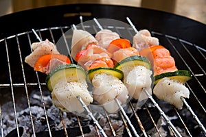 Fish spear grilling on barbecue