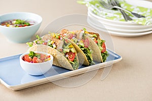 Fish tacos shell with avocado salsa