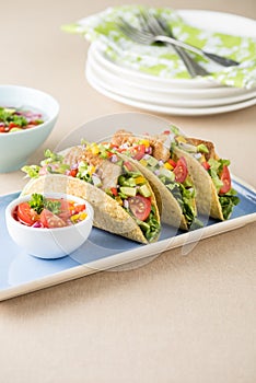 Fish tacos shell with avocado salsa