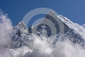 Fish Tail Summit also Machapuchare surrounded by rising clouds