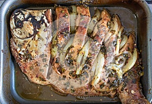 Fish `Tambaqui` roasted with onions and herbs, Traditional fish from Manaus, Amazonas / Brazil