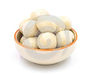 Fishballs in ceramic bowl on white background.