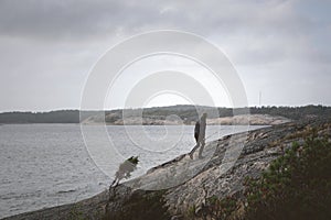 Fisher on a cliff escaping the rain.