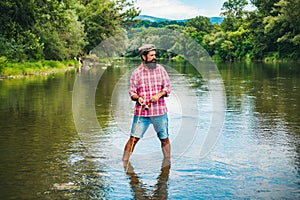 Fisher man catches a fish. Fishing skills. Hobby sport activity. Hobby for soul. Fisherman show fishing technique use