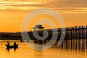Fisher man at Ubein Bridge at sunset, Mandalay, Myanmar.