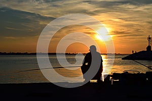 Fisher on the pier