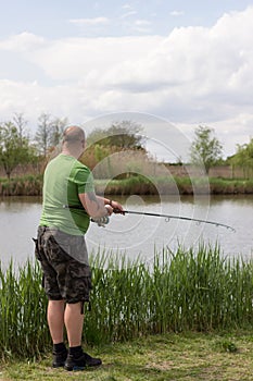 Fisherman in action, Fisherman holding rod in action