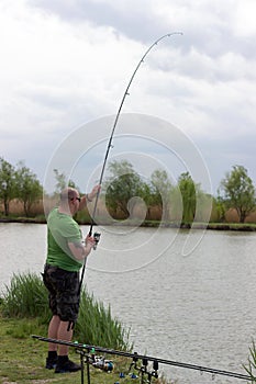 Fisherman in action, Fisherman holding rod in action