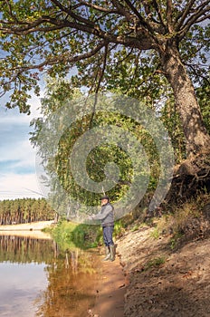 Fisherman on the bank of a beautiful river