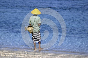 Fisherman on the beach photo