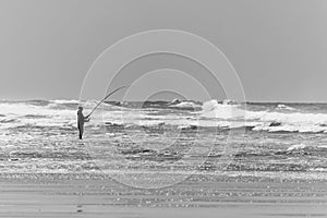 Fisherman on the beach of Le Porge, near Lacanau. Gironde, France.