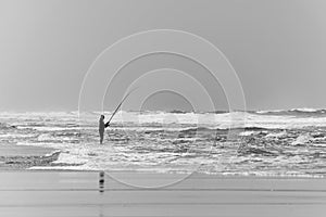 Fisherman on the beach of Le Porge, near Lacanau. Gironde, France.