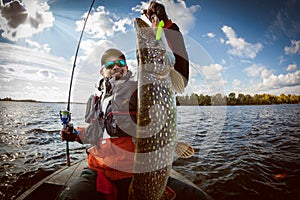 Fisherman and big trophy Pike.