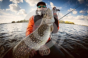 Fisherman and big trophy Pike.