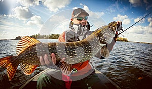 Fisherman and big trophy Pike.