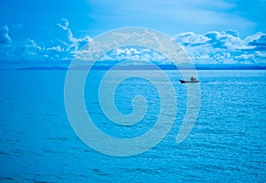 Fisherman and blue sky