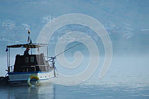 Fisherman in the boat photo