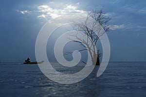 Fisherman boat in a beautiful view on the sea at sunrise