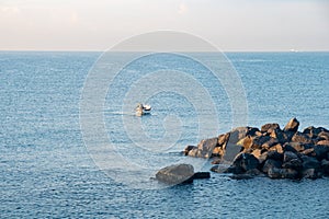 Fisherman in a boat fishing in the early morning. Mediterranean Sea