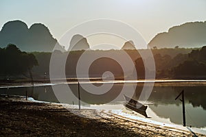 fisherman boat in Nong Thale lake at sunrise, Krabi