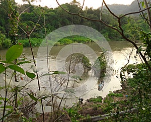 Fisherman and boat in Pasak river