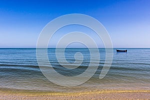 A Fisherman Boat on a Peaceful Ocean Landscape