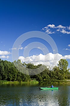 Fisherman in boat. River Drava