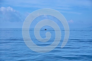 Fisherman boat sailing on lonely sea