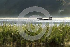 Fisherman on a boat silhouette