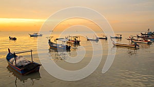 Fisherman boat on sunset photo