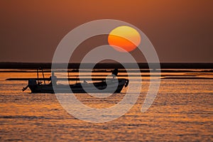 Fisherman boat at sunset