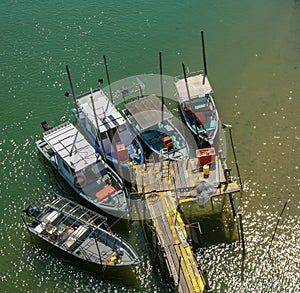 Fisherman boats anchored by a riverside in Chukai, Terengganu, Malaysia.