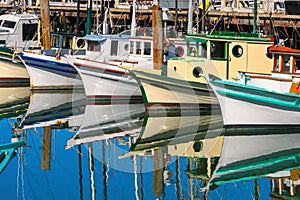 Fisherman boats reflected in the water in San Francisco, USA