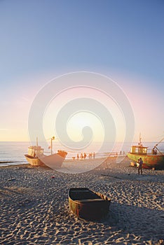 fisherman boats at sunrise time on the beach