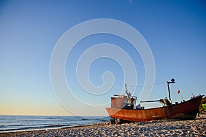 fisherman boats at sunrise time on the beach