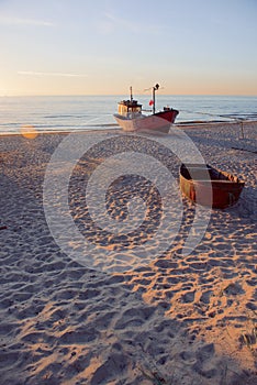 Fisherman boats at sunrise time on the beach